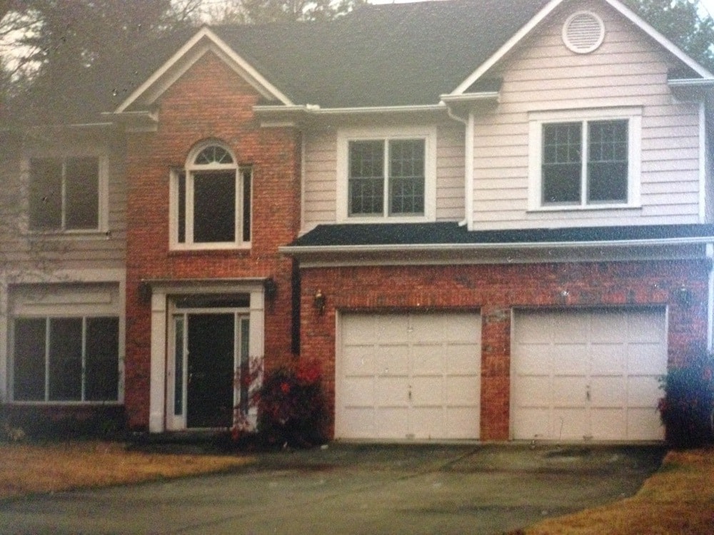 Red brick 2 story home, 2 car garage, frontyard view